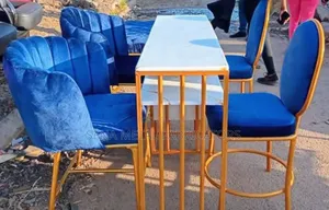 Manicure Set With Blue Chairs and a Double Table.
