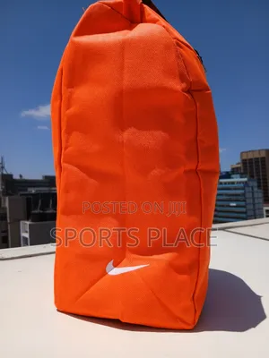 New Orange Nike Boots/Essentials Bag