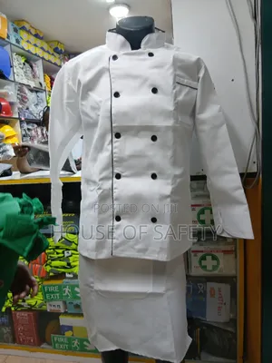 White Chef Coat Together With an Apron