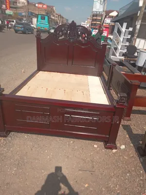 Stylish Wooden Bed With Carved Headboard
