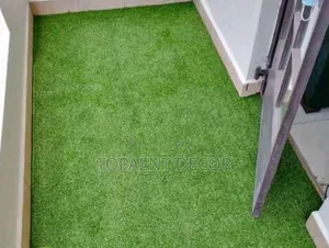Rented House Balcony Carpeted With Green Artificial Grass