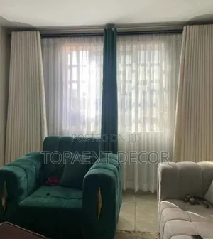 Cream Window Curtains Plus a Green Blend Window Curtains