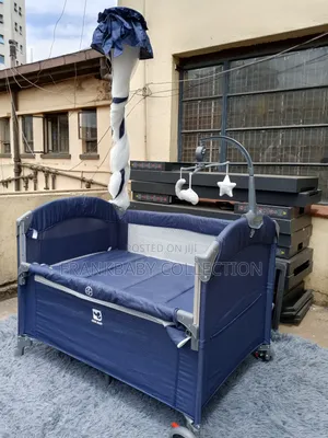 Baby Cot With Wheels and Toy Bar