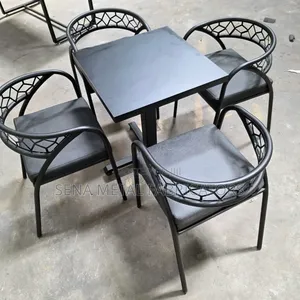 Hotel Black Chairs and a Table With a Laser-Cut Backrest