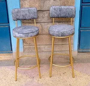 Counter Stools With Grey Patterned Fabric.