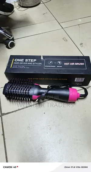 One Step Blow Hair Dryer and Volumizer Brush .