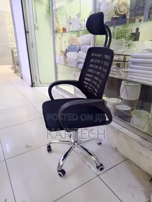 Secretarial Office Chair With a Headrest and Armrests.