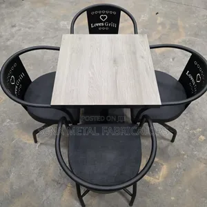 Black Restaurant Dining Set With Brown Table.