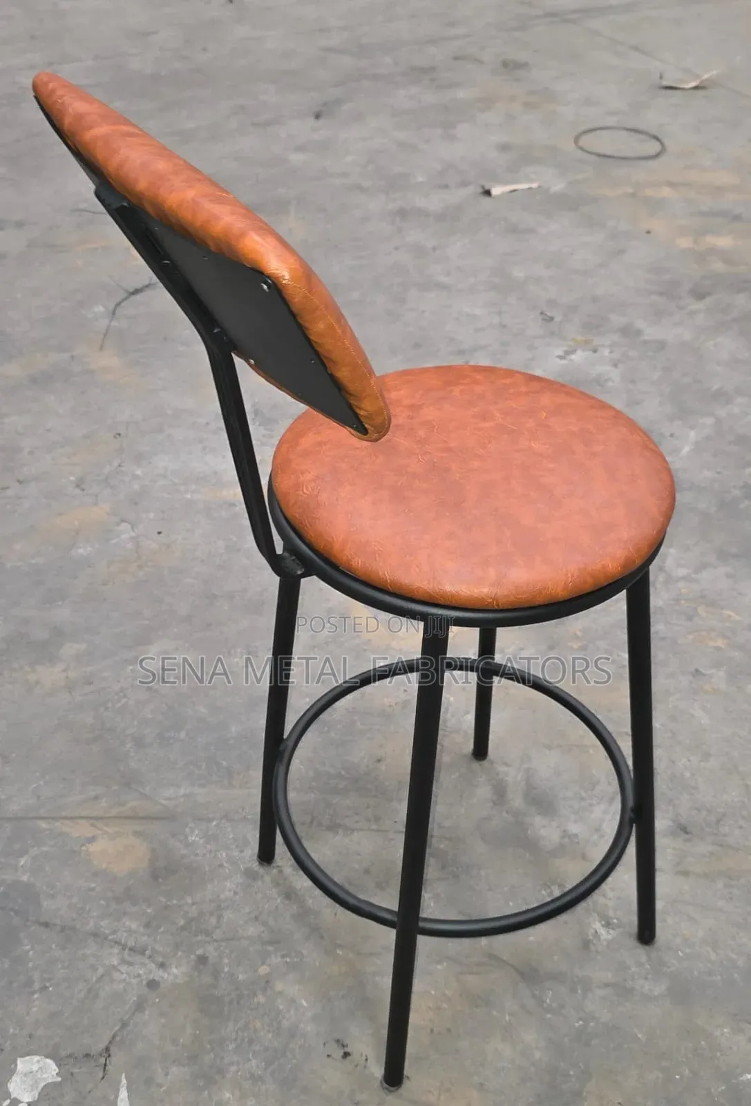 Modern Armless Backrest Counter Stool With Brown Cushion.