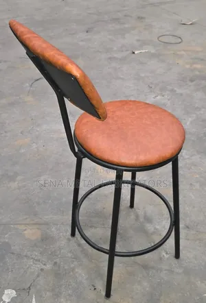 Modern Armless Backrest Counter Stool With Brown Cushion.