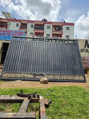 Modern Black Sliding Gate With Golden Detailing
