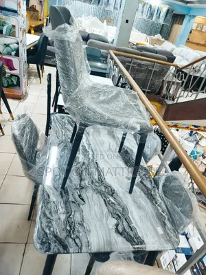 Imported Dining Set With Marble Top Table and 4 Leather Chairs.