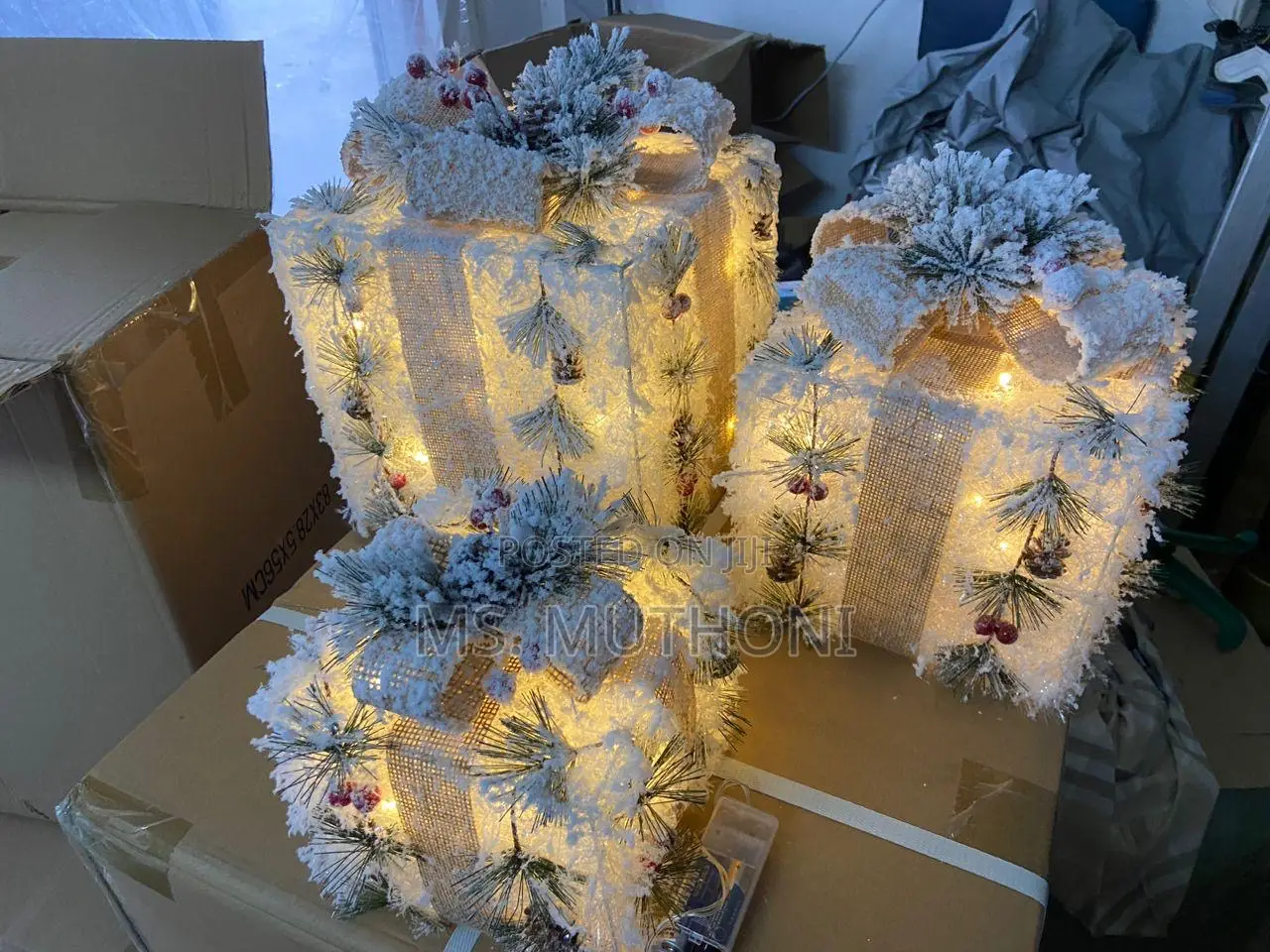 A Set of 3 Snowflocked Lighted Christmas Gift Boxes.