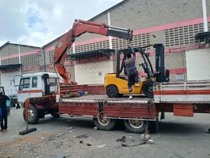Flatbed Trailer With Crane Are Ready for Hoisting and Transportation