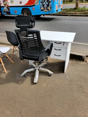 White Table and Headrest Office Chairs