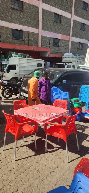 Square Plastic Table and 4 Plastic Chairs With Metal Legs
