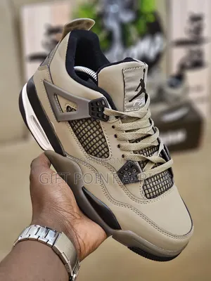 Nike Air Jordan 4 Retro Sneaker In The "Cave Stone" Colorway.