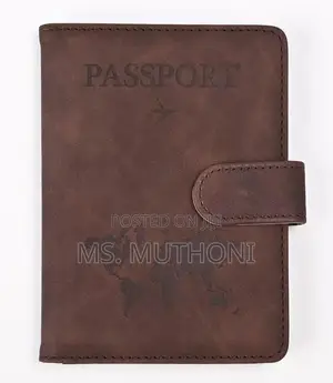 Passport Holder With a World Map Design and a Snap Closure.