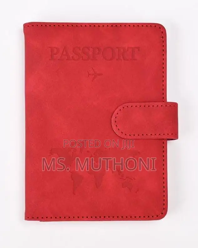 Passport Holder With a World Map Design and a Snap Closure.
