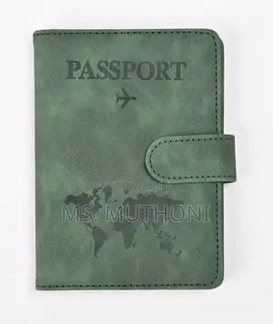 Passport Holder With a World Map Design and a Snap Closure.