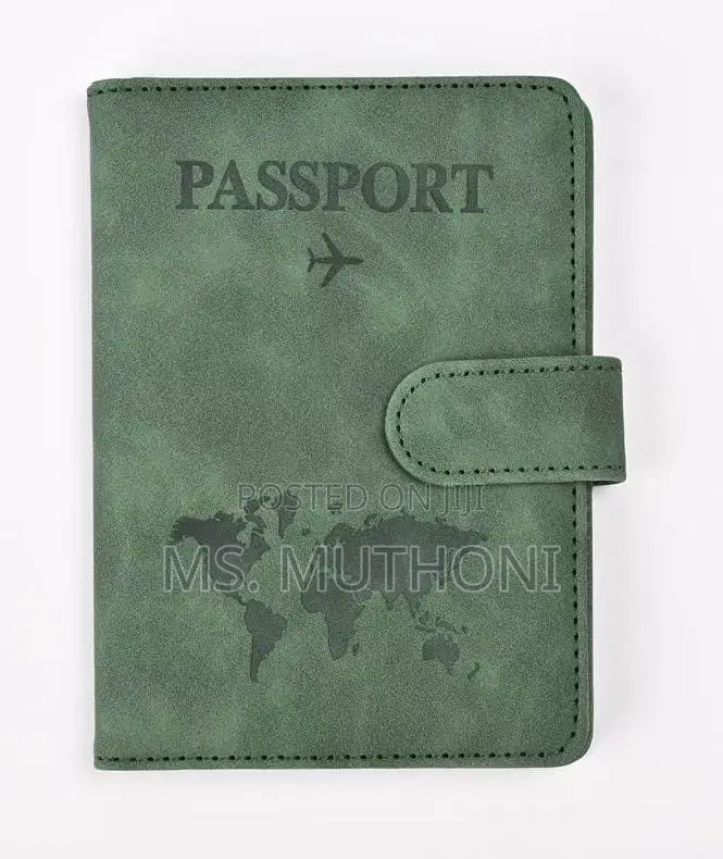 Passport Holder With a World Map Design and a Snap Closure.