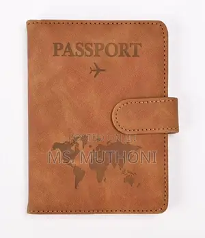 Passport Holder With a World Map Design and a Snap Closure.