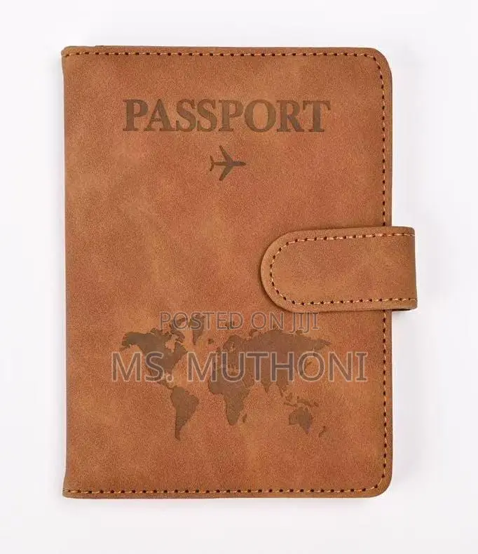 Passport Holder With a World Map Design and a Snap Closure.