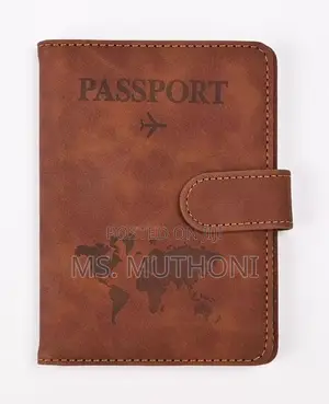 Passport Holder With a World Map Design and a Snap Closure.