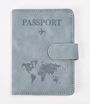 Passport Holder With a World Map Design and a Snap Closure.
