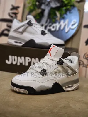 Nike Air Jordan 4 Retro "White Cement" Sneakers.