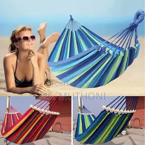 Blue and Green Striped Canvas Hammock With Spreader Bars.
