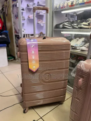 Large Rose Gold Suitcase. Height 63cm