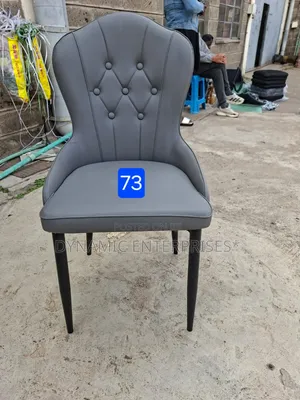 Gray Tufted Dining Chair With Black Legs