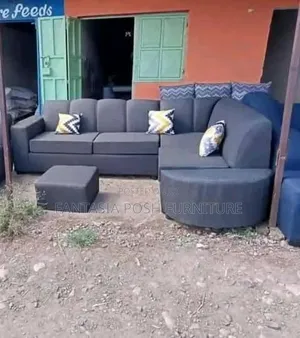 Dark Grey L-Shaped Sofa With Round Chaise and Ottoman