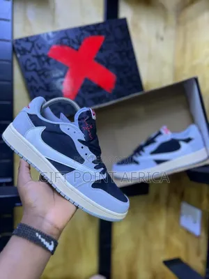 Nike Air Jordan 1 Low Travis Scott In A Black And Grey Colorway.