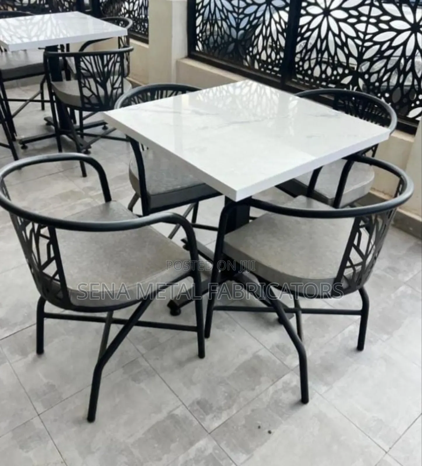 Pattern Restaurant and Hotel Chairs With a Glossy Table Top.