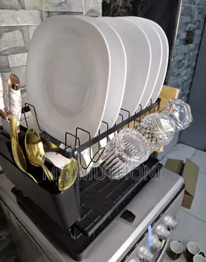 Dish Drying Rack With a Drainboard and Utensil Holder.