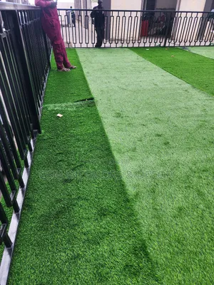 Artificial Green Grass Carpets in Grilled Field