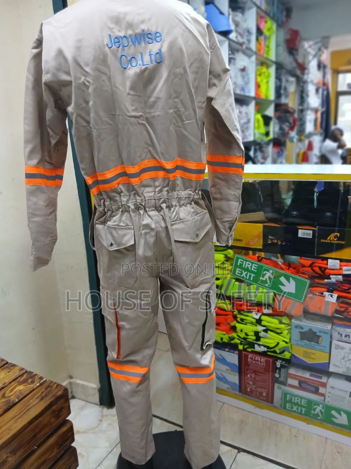 Beige Coveralls Reflective With Pockets That Allow Tools Small Items