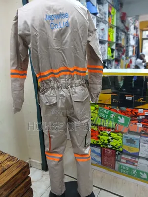Beige Coveralls Reflective With Pockets That Allow Tools Small Items