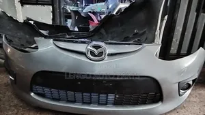 Mazda Demio 2010 Front Bumper Complete With Grille and Foglights