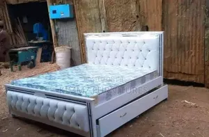 Striped Mocket Bed With Mattress and an Underbed