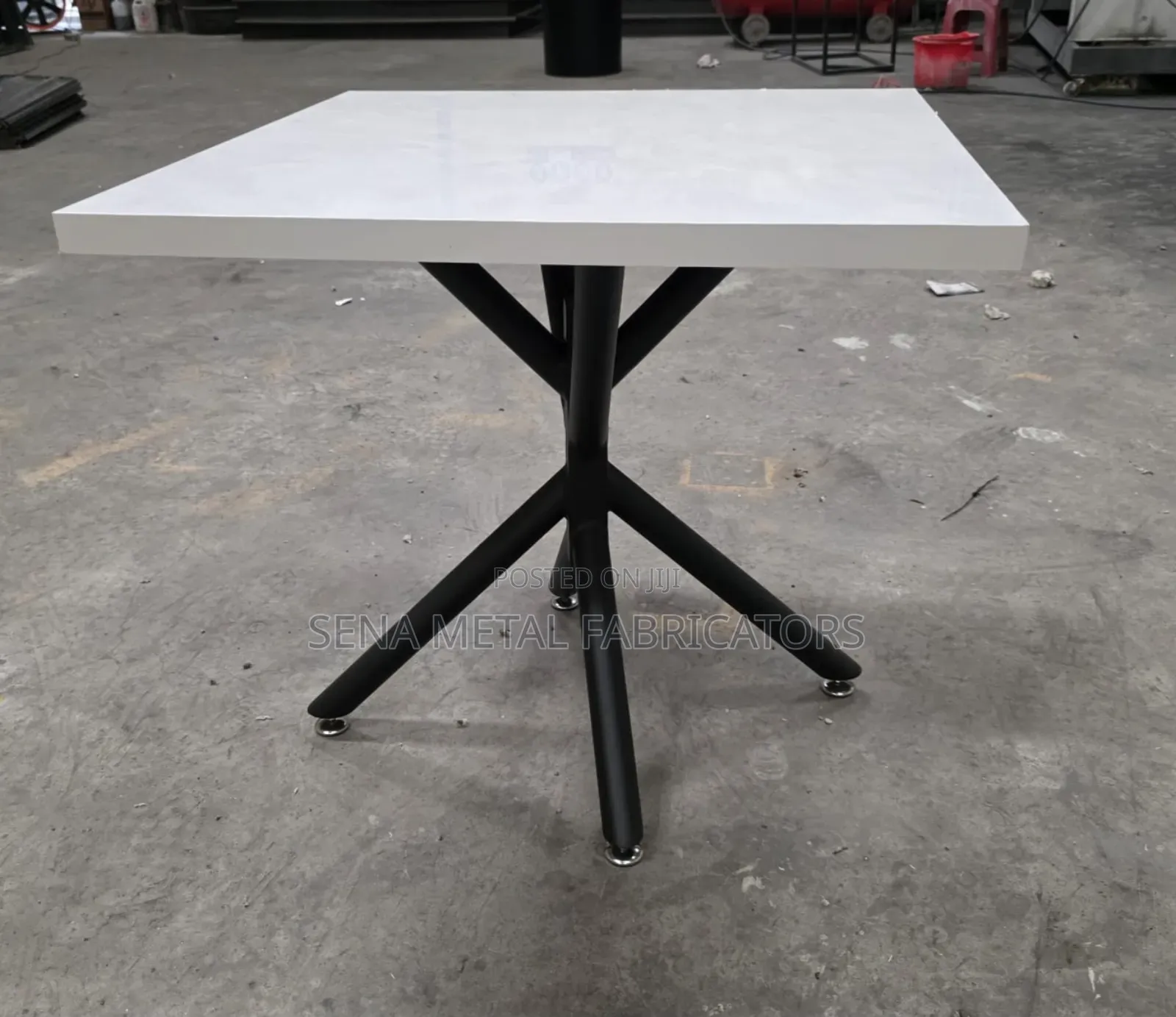 Modern White Bistro Table,Sleek Top on a Sturdy Metal Frame.
