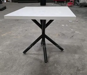 Modern White Bistro Table,Sleek Top on a Sturdy Metal Frame.
