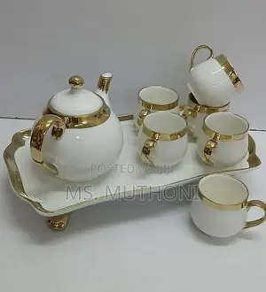 8-Piece Ceramic Tea Set With a White and Gold Finish.