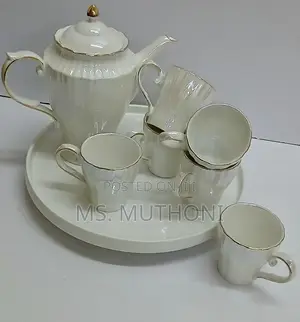 White Porcelain Tea Set With Gold Trim.