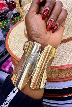 Ladies Statement Wide, Gold-Tone Metal Cuff Bangles.
