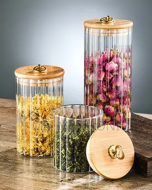 A Set of 3 Glass Food Store Jars With Bamboo Lids.