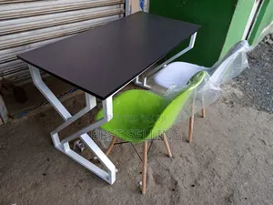 Dark Grey Board Metallic Stand Table and Eams Chair