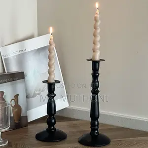 Set of Three Matte Black Metal Taper Candle Holders With Gold Accents